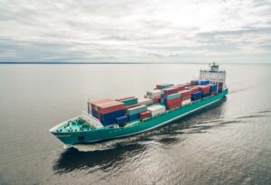 Cargo ship in middle of the ocean with colorful containers (section 301)